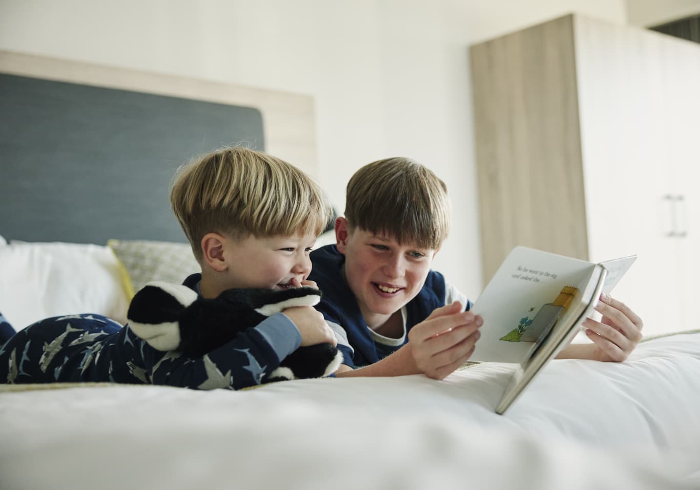 Children Reading in Family Bedroom